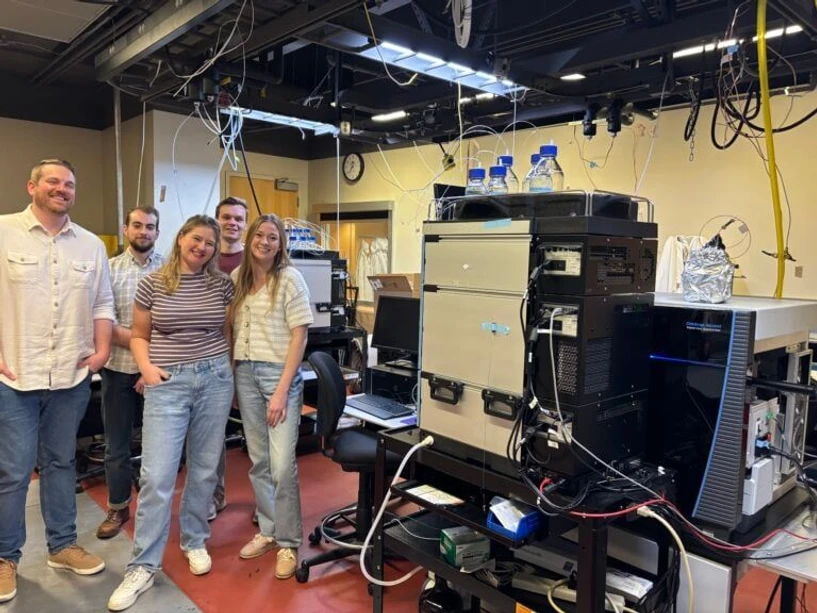 Thermo Fisher Scientific: What Happens When Glycoproteomics Meets Real-Time LC-MS Decision Making?: Lab members pictured left to right in front of Riley Group’s Thermo Scientific Orbitrap Ascend MultiOmics Tribrid Mass Spectrometer coupled with a Thermo Scientific Vanquish Neo UHPLC System: Nick Riley, Emmajay Sutherland, Jacob Russell, Tim Veth, Kayla Markuson.